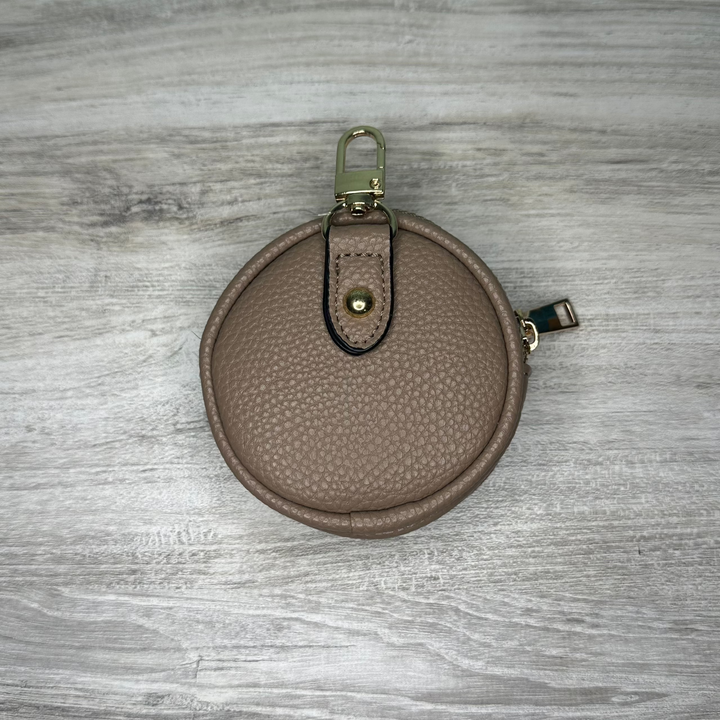 Elegant leather coin wallet with secure snap closure, compact and stylish design, perfect for carrying loose change and small essentials.