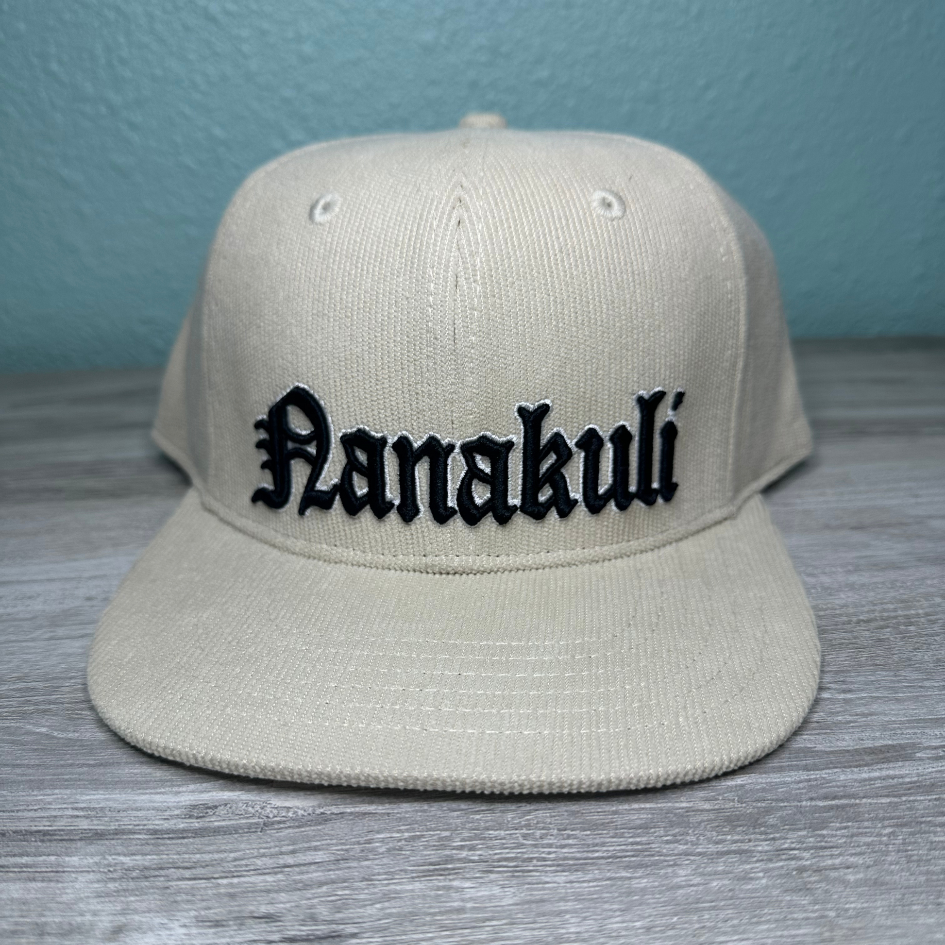 Nanakuli corduroy hat with a stylish design, comfortable fit, and embroidered logo, perfect for showing pride and adding a touch of personality to any outfit.