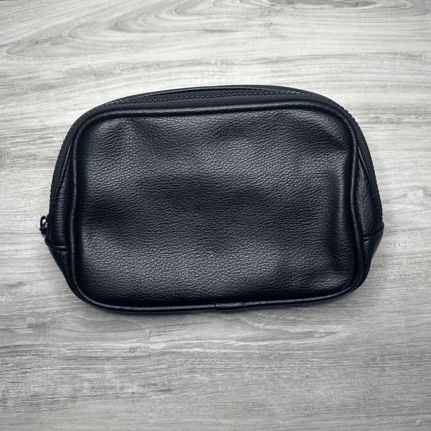 Single pouch bag with a compact design and spacious interior, perfect for carrying essentials, featuring durable material, stylish look, and a convenient adjustable strap.