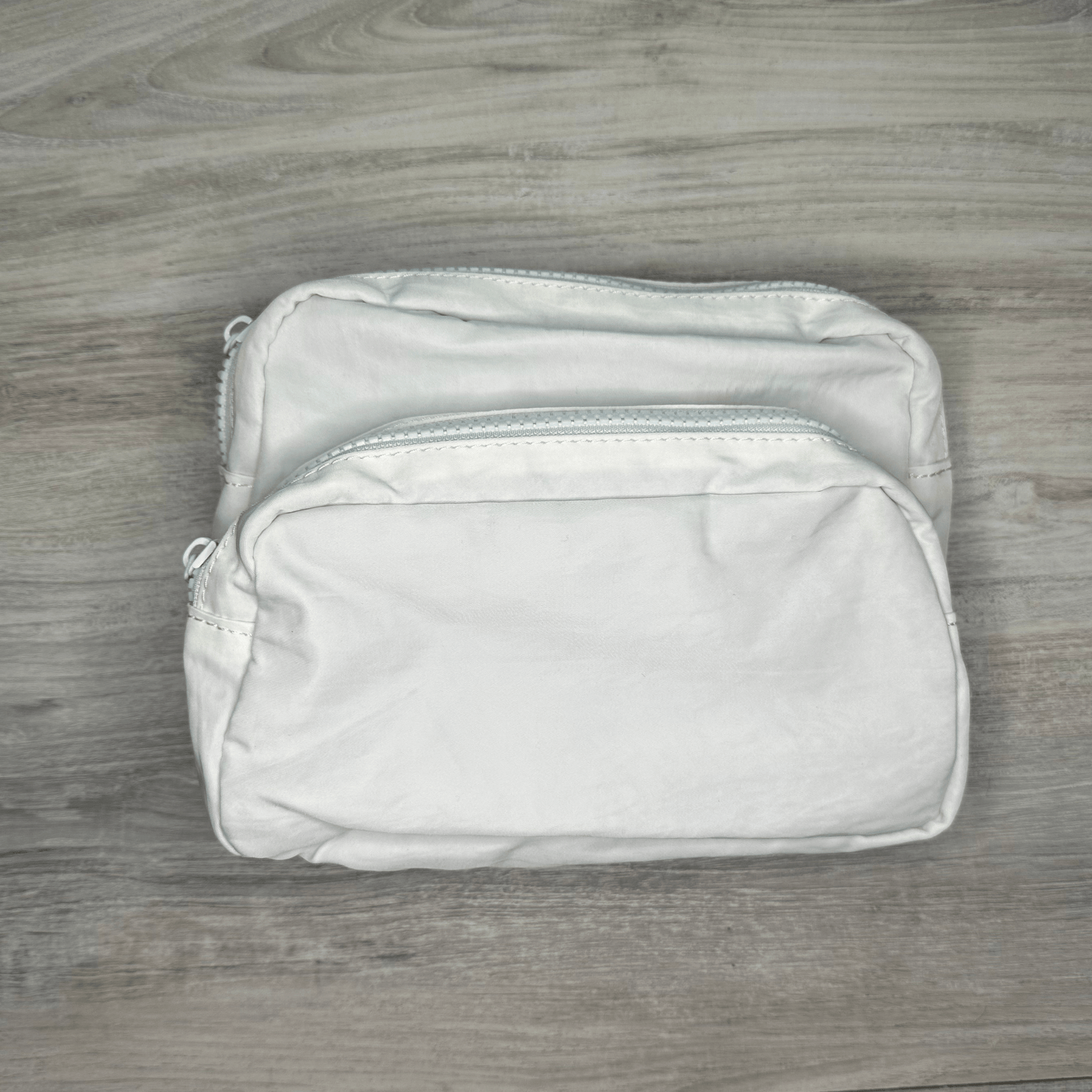 Double pouch bag with two spacious compartments, perfect for organizing essentials, featuring durable material, stylish design, and a convenient adjustable strap.