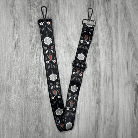 Flower bag strap with a vibrant floral pattern, adjustable length, and sturdy construction, perfect for adding a touch of style and personalization to your bags