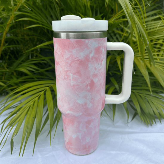 Pink tie-dye flask with a unique, vibrant pattern, perfect for carrying beverages in style, featuring a secure screw cap and durable construction.