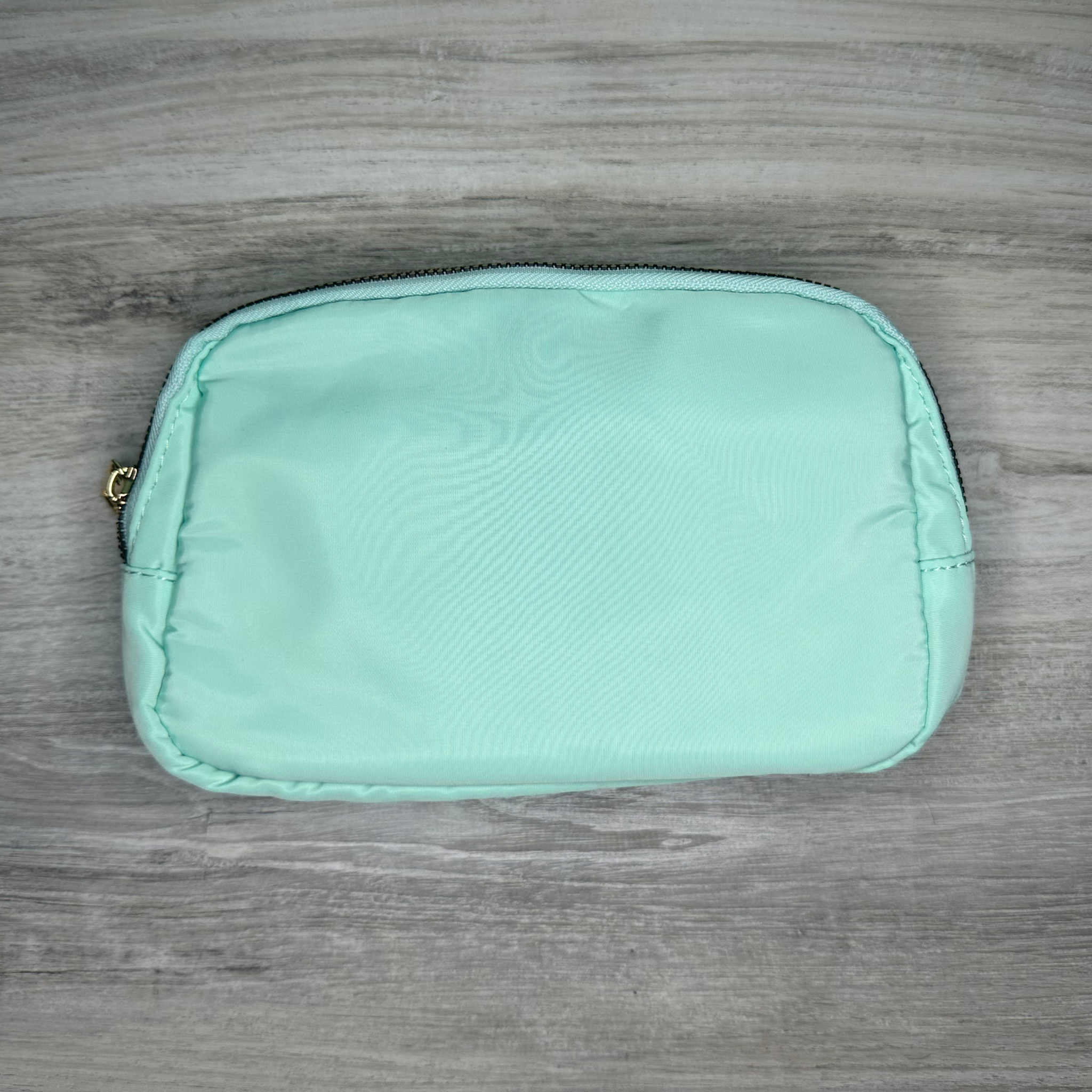 Single pouch bag with a compact design and spacious interior, perfect for carrying essentials, featuring durable material, stylish look, and a convenient adjustable strap.