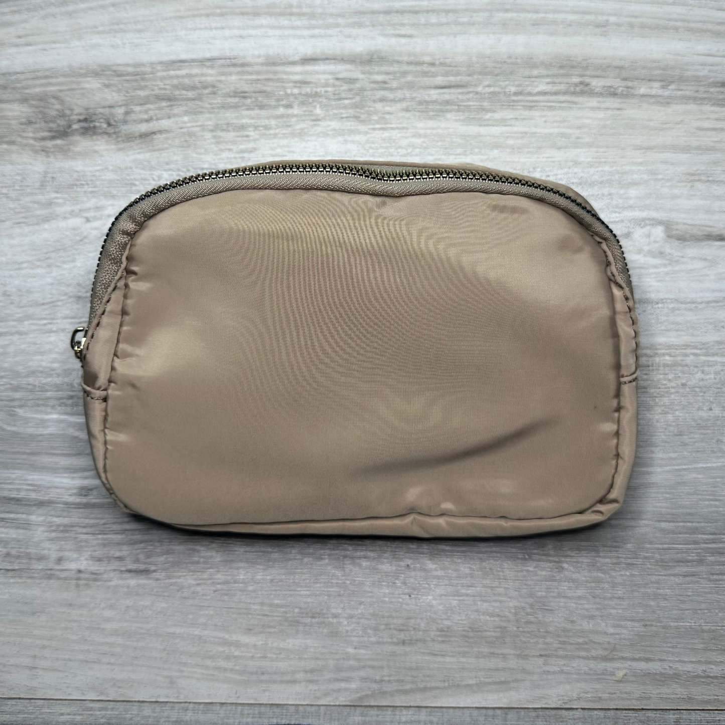 Single pouch bag with a compact design and spacious interior, perfect for carrying essentials, featuring durable material, stylish look, and a convenient adjustable strap.