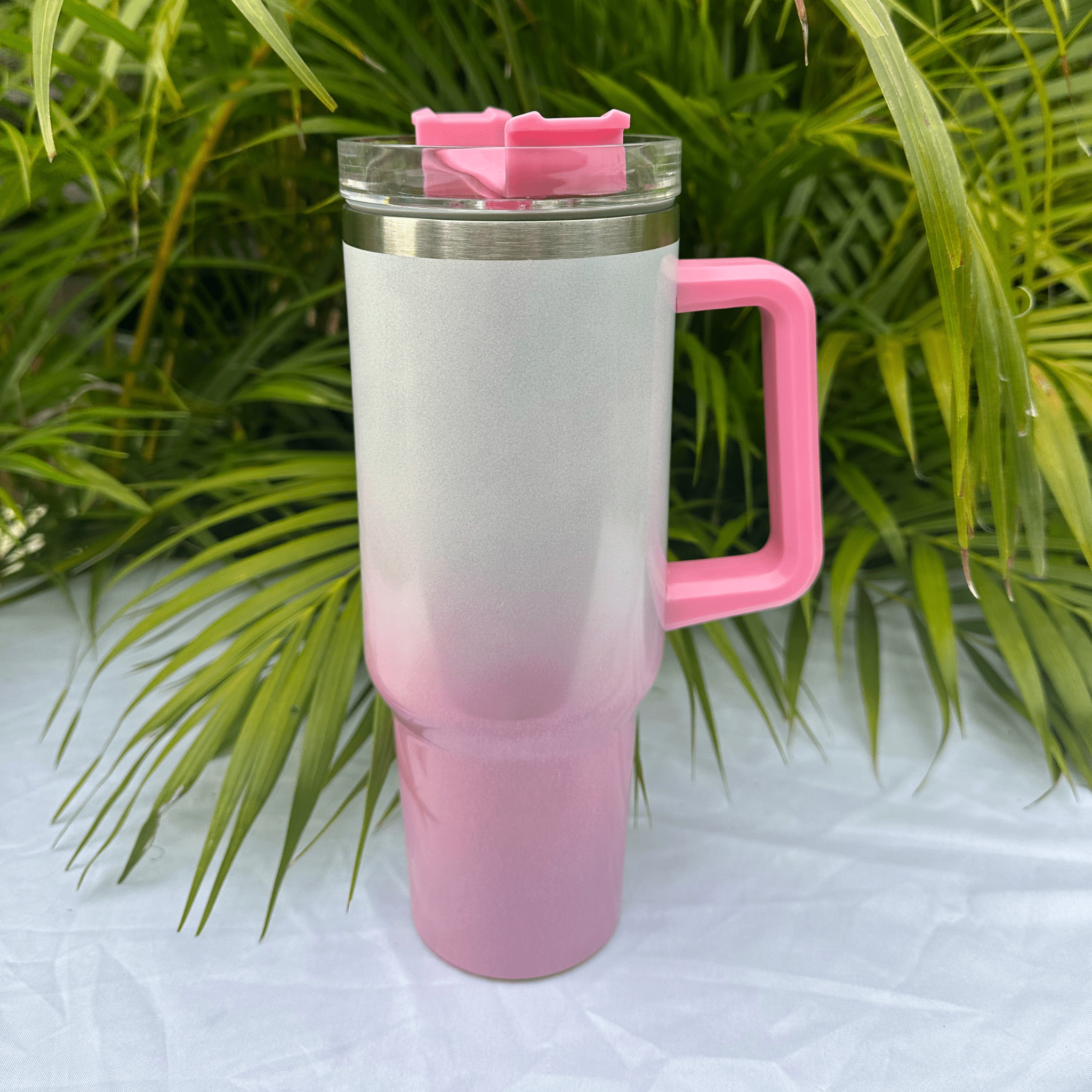 White and pink glitter flask with a sparkling, eye-catching finish, perfect for carrying beverages in style, featuring a secure screw cap and durable construction.